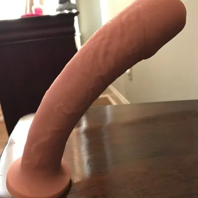 Attach the  dildo to a table